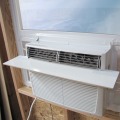 A window air conditioner unit installed in a window opening.