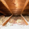 White insulation in a wood attic
