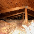 White insulation in a wood attic